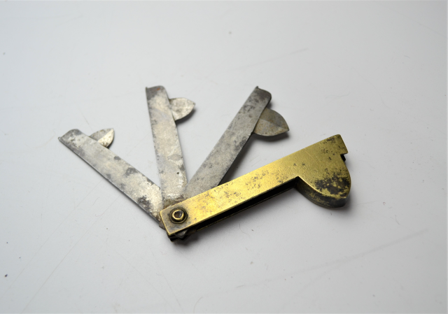 19th Century brass fleam knife by W. Searls.