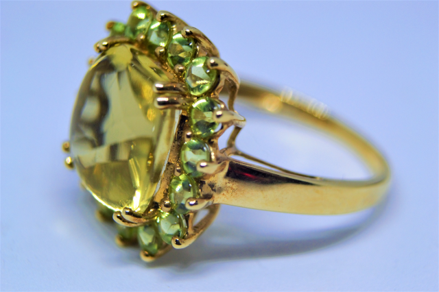 A 9ct Gold With Peridot Cluster Ring.