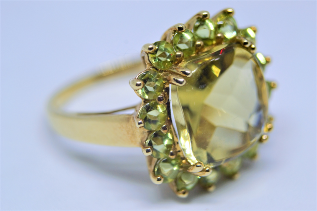 A 9ct Gold With Peridot Cluster Ring.