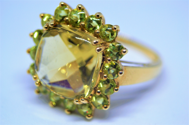 A 9ct Gold With Peridot Cluster Ring.