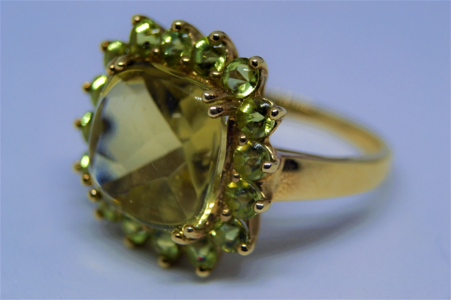 A 9ct Gold With Peridot Cluster Ring.