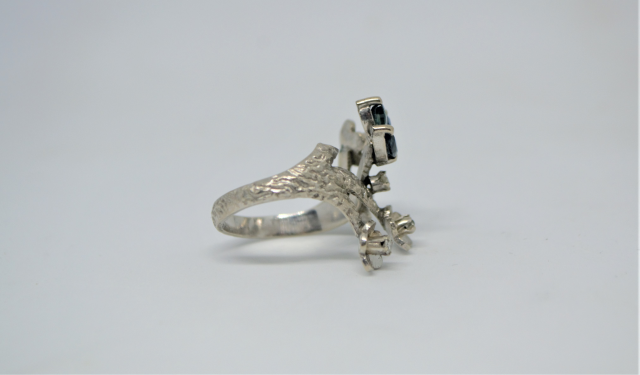 A White Metal With Sapphire And Diamond Abstract Ring.