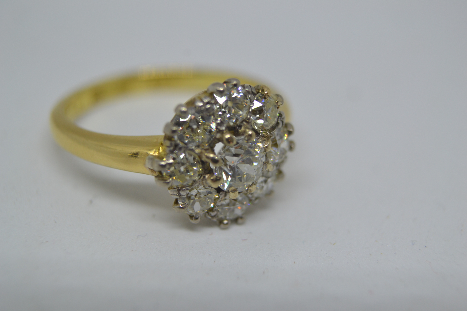 An 18 ct Gold  Diamond Flower Head Cluster Ring