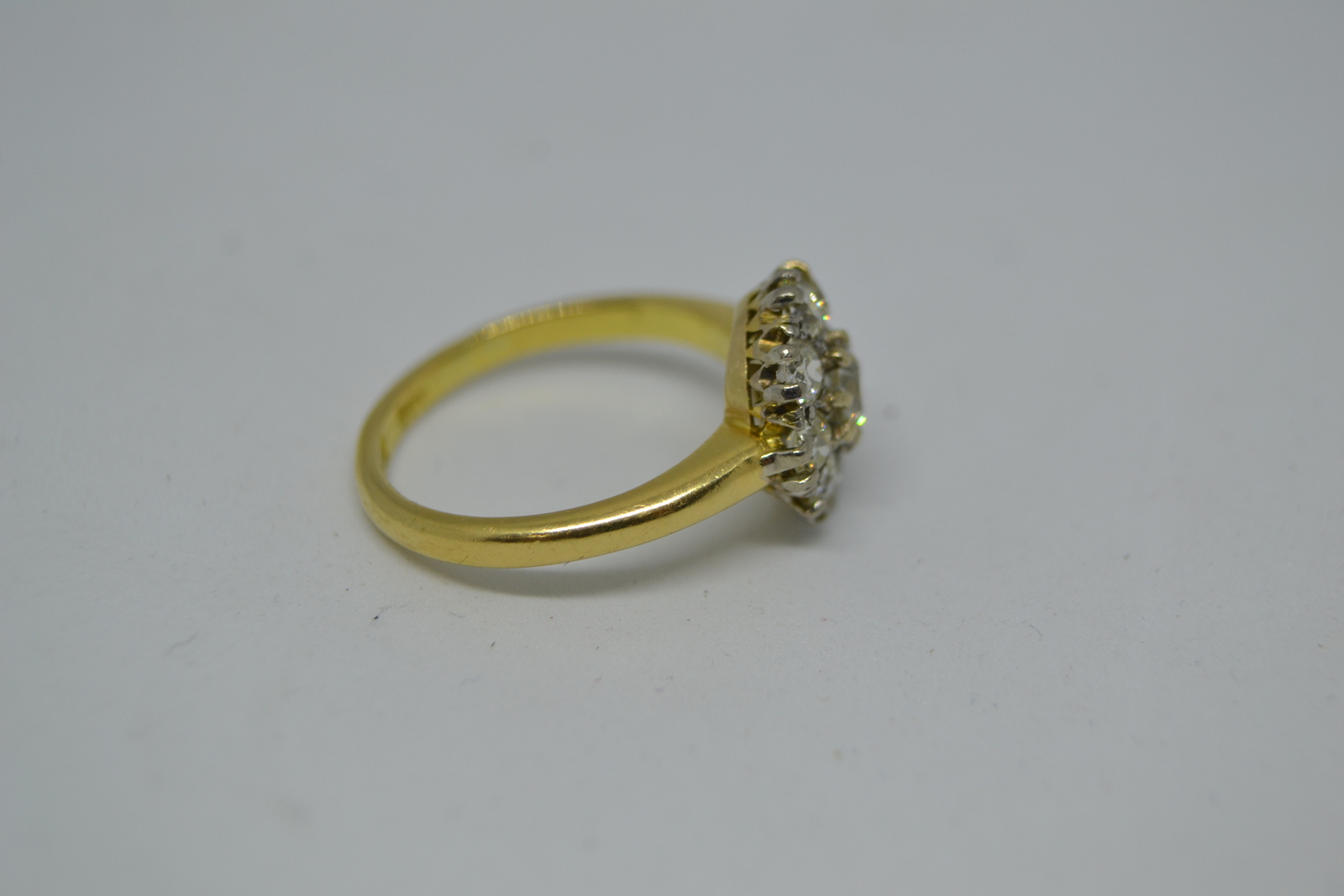 An 18 ct Gold  Diamond Flower Head Cluster Ring