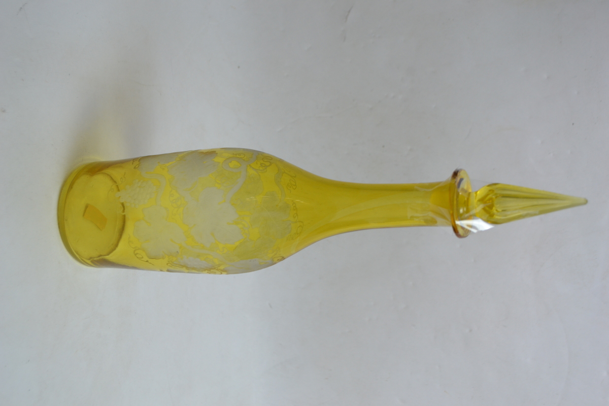 A 19th Century Continental Bottle Form Decanter Cased in Citron