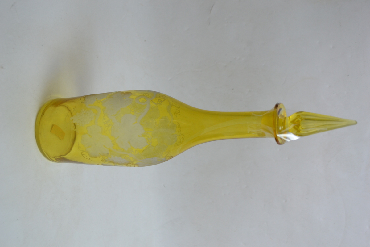 A 19th Century Continental Bottle Form Decanter Cased in Citron