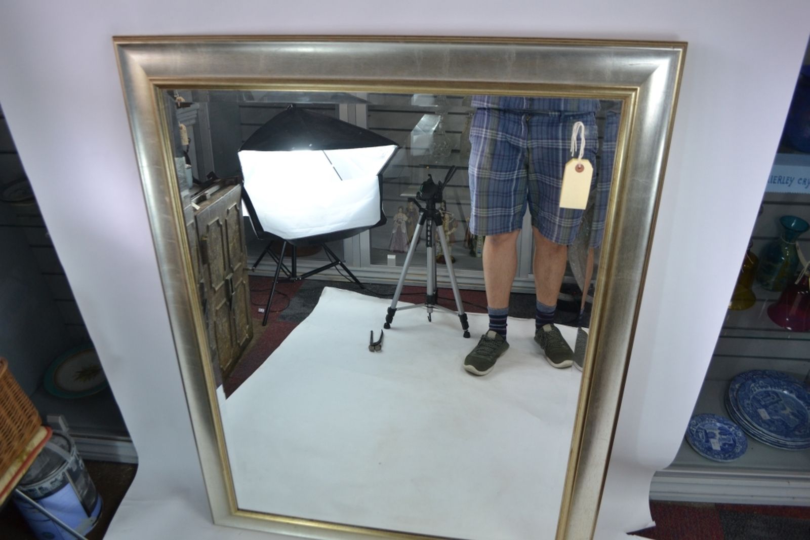 Gilt framed bevelled edge mirror.