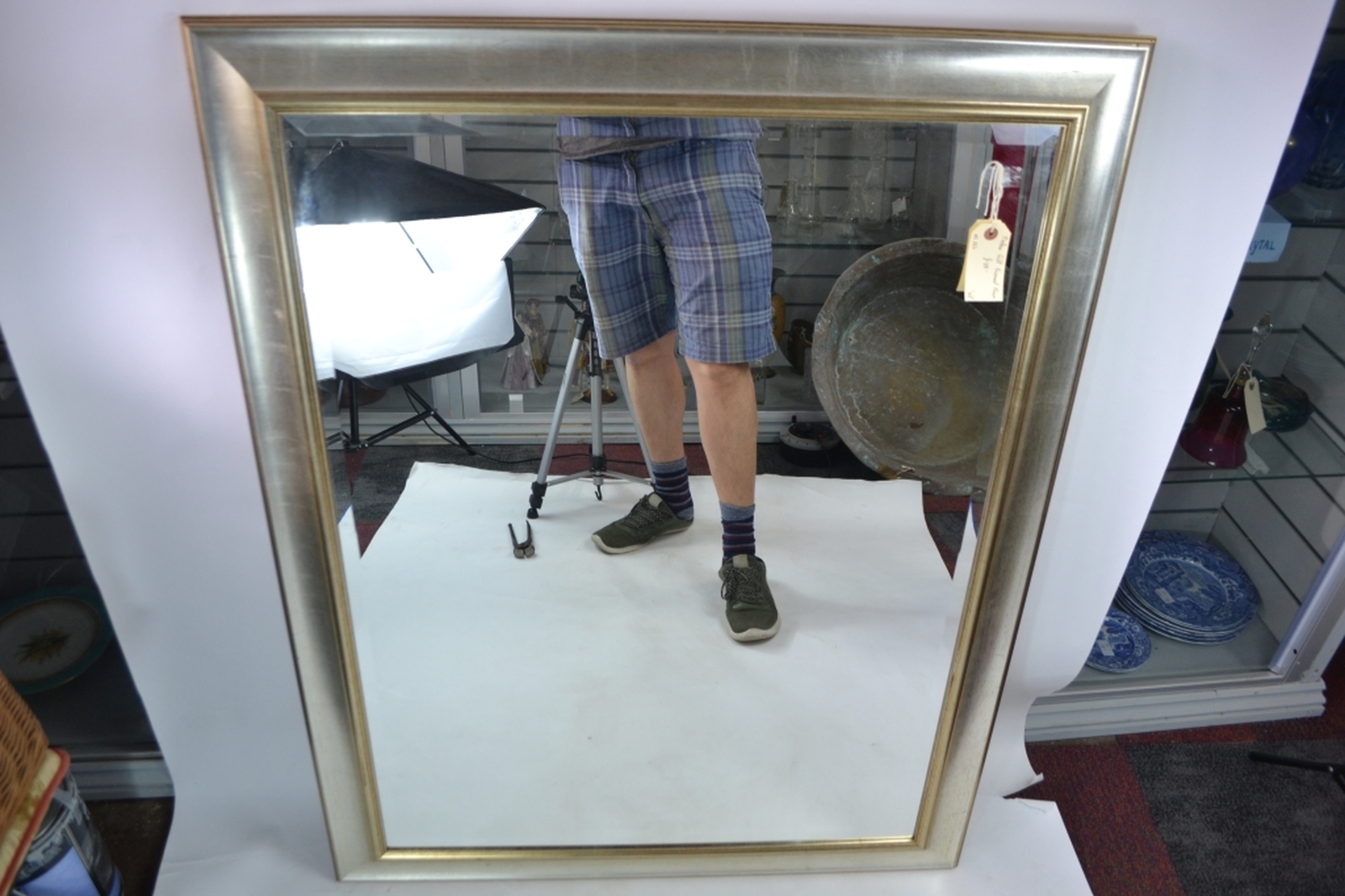 Gilt framed bevelled edge mirror.