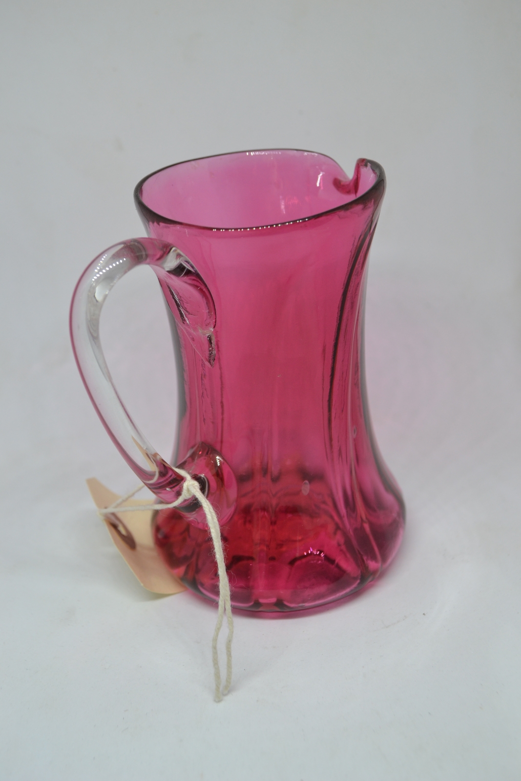 A Cranberry Milk Jug, c1860.