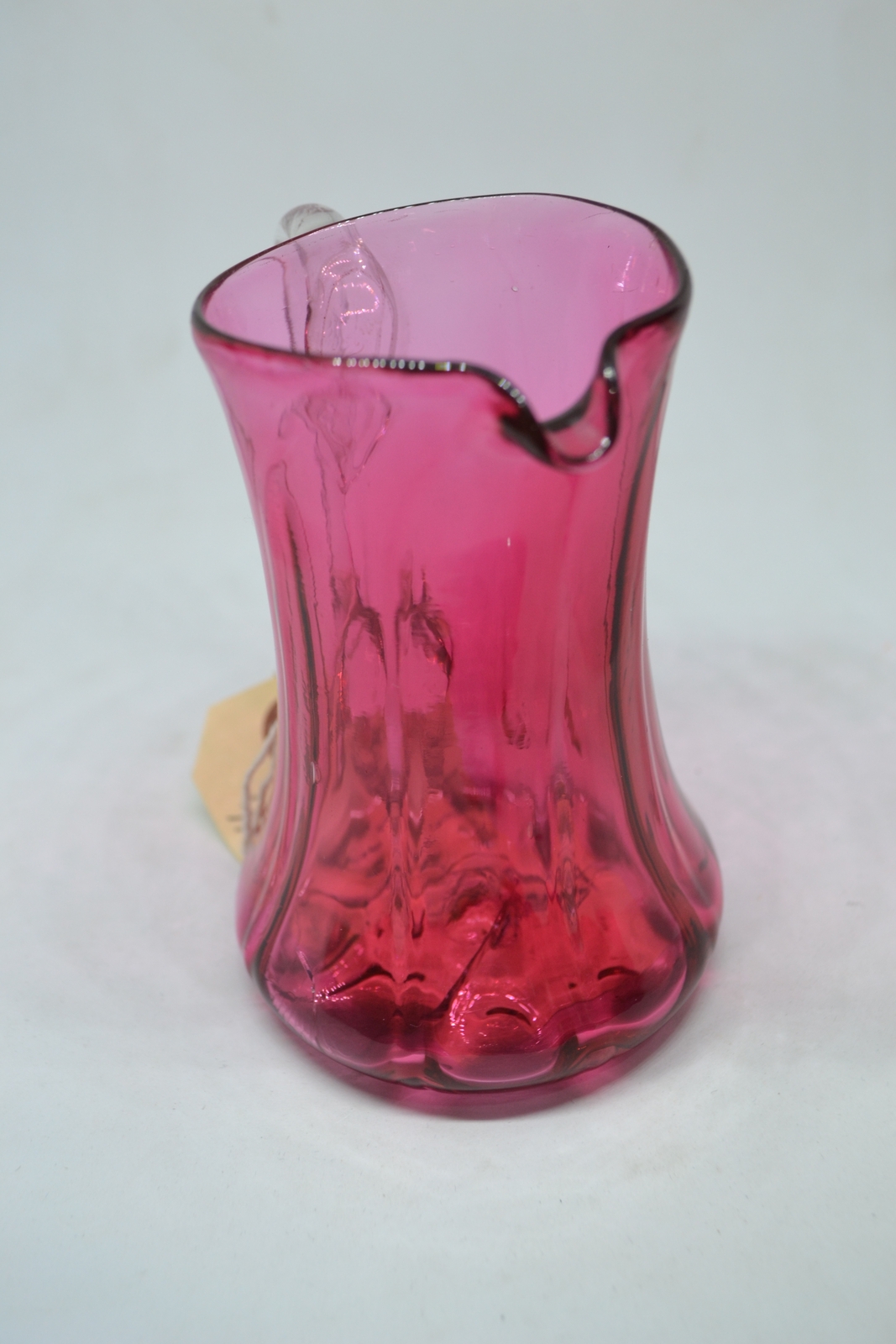 A Cranberry Milk Jug, c1860.