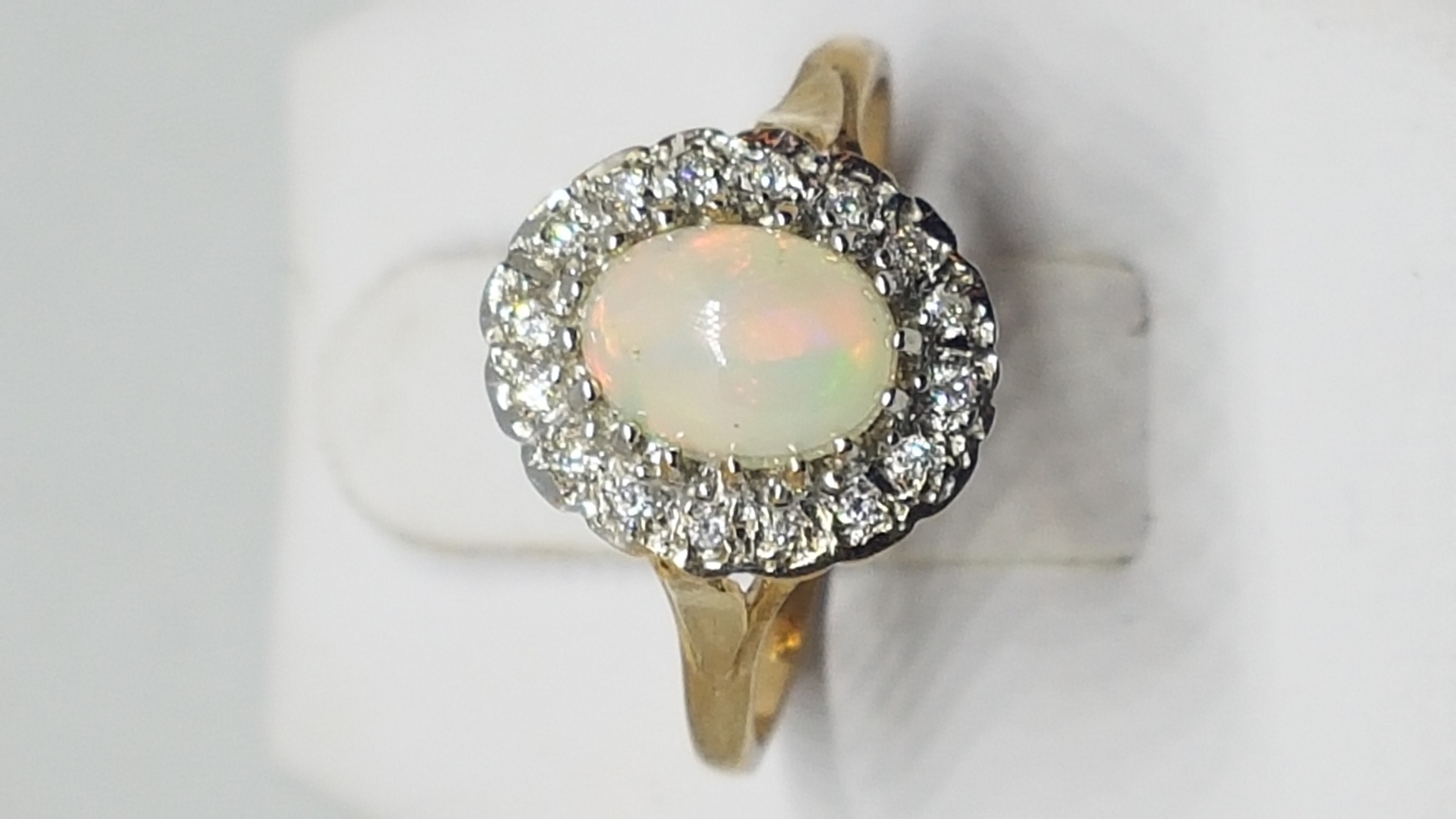 A 9 ct Gold Opal And Diamond Cluster Ring