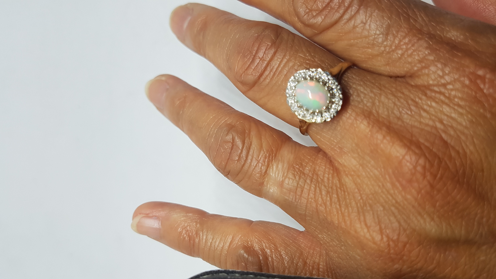 A 9 ct Gold Opal And Diamond Cluster Ring