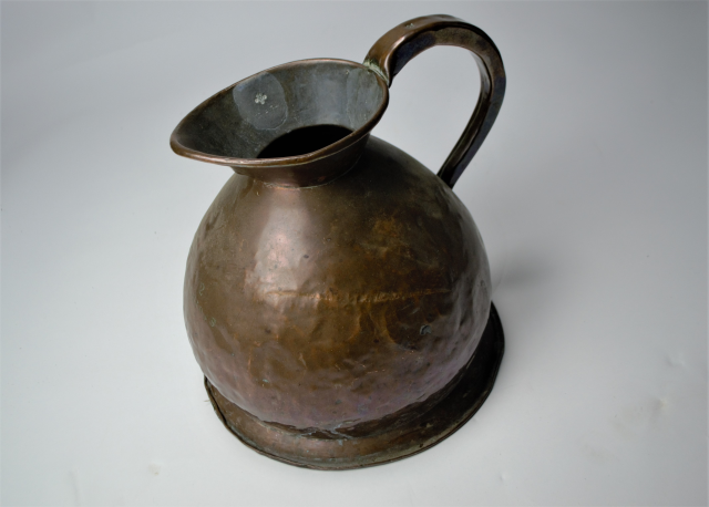 An Early 19th c. Two Gallon Copper Hay Stack Jug. 29 cm high.