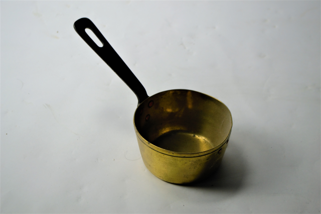 A Small Brass Pan With Long Handle